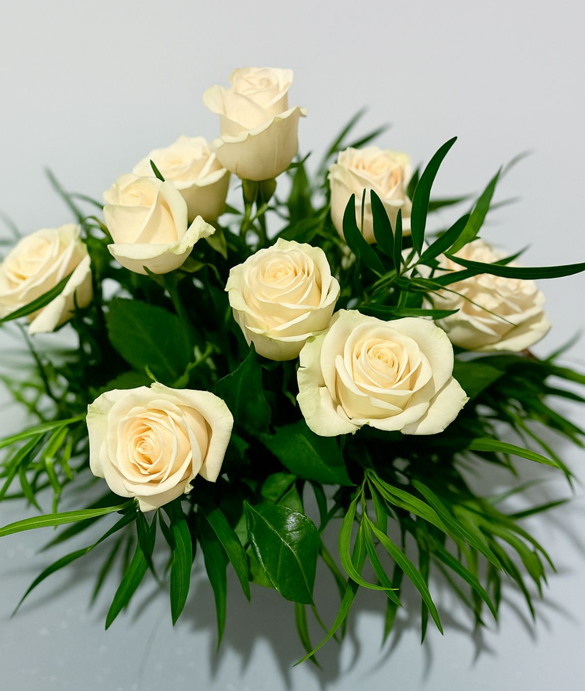 ARREGLO FUNEBRE 11 ROSAS BLANCAS